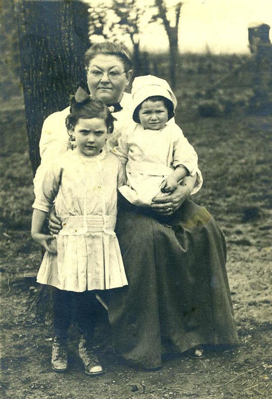 [Woman and two children]